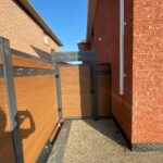 Composite Privacy Fence with Composite Gate-Woodgrain Composite Fence with Latice Installed in Brampton